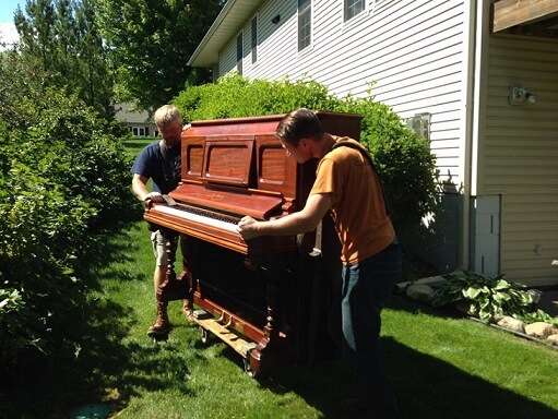 Skilled Piano Removal Specialists Protecting Floors And Walls During Relocation